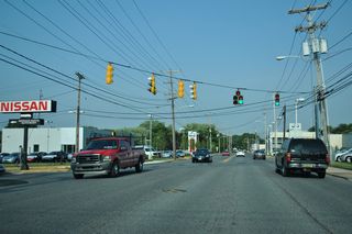The signal at Winner Boulevard was installed in the mid 1990s. The access road serves a multitude of car dealerships on the north side of Cleveland Avenue.