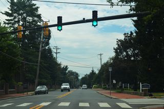 A pedestrian signal operates at S College Avenue and Kent Way.