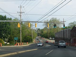 Lowering into the city of Newark, Paper Mill Road meets Old Paper Mill Road at a set of mast-arm supported traffic lights. Old Paper Mill provides the lone outlet to several subdivisions east of Newark Reservoir.