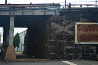 Vintage railroad crossing sign along 12th Street east at Claymont Street.