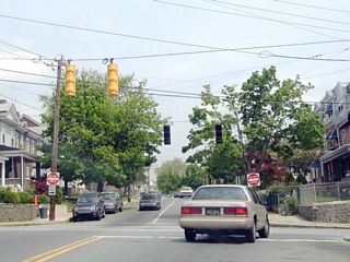 Broom Street becomes one way southbound beyond the intersection with Lancaster Avenue (SR 48) east. Mast arm signals replaced these span wire assemblies by 2014.