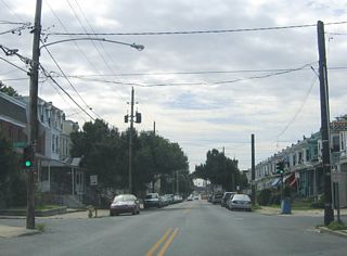 Locust Street flows southbound from E 27th Street by Brown Burton Winchester Park to cross Vandever Avenue through to E 16th Street.