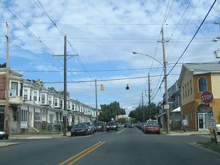 One block west of U.S. 13 (Northeast Boulevard), Vandever Avenue intersects Thatcher Street at a stop sign and set of flashers. Thatcher Street heads north to the Eastlake community and south as a cutoff to U.S. 13.