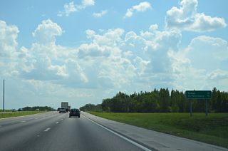 Continuing across the Green Swamp, Interstate 4 is 52.3 miles from the Tampa city center and 74.5 miles from Downtown St. Petersburg via I-275 south and I-375 east.This sign was removed in 2023.