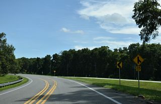 Turning north at Kingsley Village, SR 16 overtakes SR 230 east at a wye intersection.