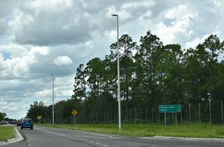 SR 16 continues 1.3 miles west from SR 23 to the settlement of Pass Station and the Penney Farms town line.