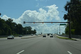 Holly Point Road returns to U.S. 17 at a set of flashers west from near Orange Point. Holly Point Road W continues the street northwest to the Laurel Grove neighborhood.