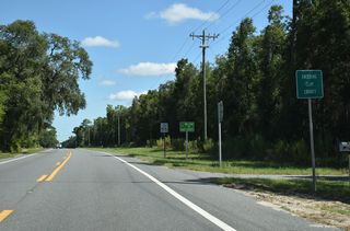 North from Melrose, SR 21 enters the southwestern corner of Clay County for 0.83 miles.