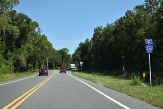 The western leg of County Road 214 encircles Lake Geneva east between SR 21 and SR 100 along a 4.64 mile long course.
