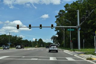 The intersection with Long Bay Road (CR 220A) was relocated northward and signalized during widening of SR 21 in 2021/22.