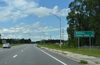 The city of Keystone Heights lies 26 miles southwest of the exchange joining SR 21 (Blanding Boulevard) with SR 23 (First Coast Expressway).