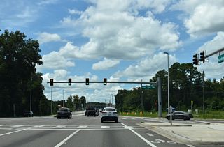 Long Bay Road (CR 220A) was realigned to a new signalized intersection with SR 21 by 2021.
