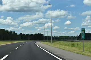 SR 23 makes a sweeping curve northward ahead of the CR 315 (Springpark Road) underpass and the diverging diamond interchange (Exit 20) with SR 16.