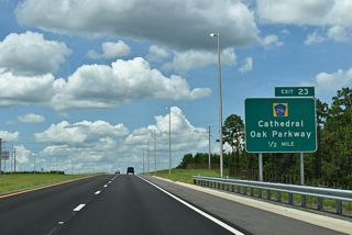 Cathedral Oak Parkway was constructed in conjunction with the First Coast Expressway. The suburban arterial weaves across land slated for future development.