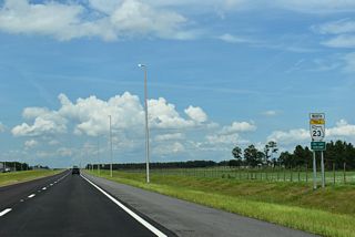 Land clearing for additional suburban development was already underway along the east side of the First Coast Expressway right after the toll road opened through the Asbury Lake community.