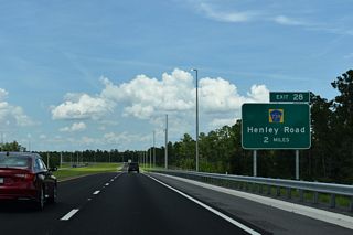 SR 23 makes a 90 degree turn west ahead of the DDI (Exit 28) with CR 739 Henley Road).
