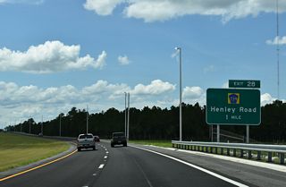 The First Coast Expressway crosses Bradley Creek one mile east of Exit 28 to Henley Road. CR 209 (Russell Road) parallels the toll road to the north along the ensuing stretch.