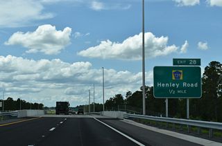 CR 739 (Henley Road) is a five lane suburban boulevard south through Asbury Lake to CR 220. North across Black Creek, Henley Road leads to CR 220 at Rattlesnake Bend between Middleburg and Doctors Inlet.