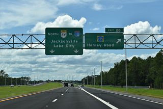 Exit 28 leaves SR 23 (First Coast Expressway) northbound for CR 739 (Henley Road). Henley Road north extends to SR 21 (Blanding Boulevard) at Old Jennings Road (CR 220A) west.