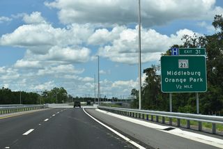 SR 23 crosses Grog Branch and CR 220 ahead of Exit 31.