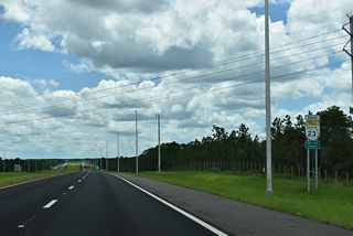 The First Coast Expressway shifts southeast from Exit 23 by Peters Creek.