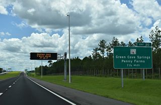 The third DDI in succession along SR 23 south joins the First Coast Expressway with SR 16 at Exit 20 in 1.25 miles.