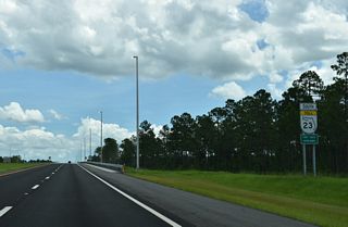 SR 23 heads east from Henley Road to an underpass built by the Bradley Creek subdivision located off paralell CR 209 (Russell Road).
