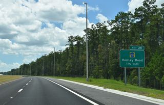 The first of four exits along the First Coast Expressway section opened on August 9, 2025 connects SR 23 with CR 739 (Henley Road) in 1.25 miles.