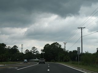 Diverging from the parallel Georgia & Florida Company Railroad, U.S. 27 curves west into the Perry street grid at Maurice Linton Road.