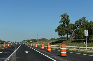 SR 50 advances east from U.S. 301 and Ridge Manor across a swath of ranch land to an overpass spanning a CSX Railroad line.