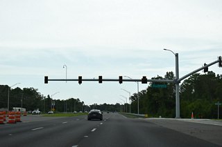 N Sunlake Boulevard and Rhombus Court meet SR 52 at the ensuing traffic light. N Sunlake Boulevard heads south through the Angeline development to Ridge Road.