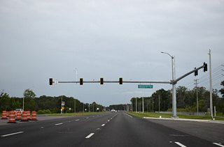 SR 52 meets N Sunlake Boulevard and Rhombus Court midway between Kent Grove Drive and Shady Hills Road. N Sunlake Boulevard extends south into the Angeline development. A second segment of Sunlake Boulevard continues from near Bud Bexley Parkway south into northern Hillsborough County.