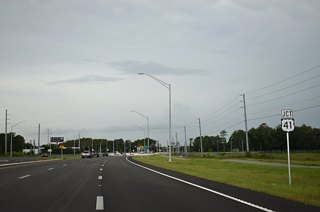 SR 52 widens to a six lane arterial ahead of meeting U.S. 41 (Land O' Lakes Boulevard) at Gowers Corner.