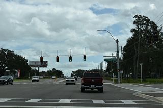 Four lane expansion of then-SR 54 at Ernest Drive south and Avalon Park Boulevard north included adding traffic lights.