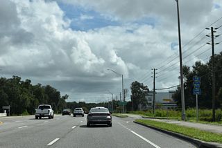 CR 577 (Curley Road) branches northeast from the forthcoming intersection.