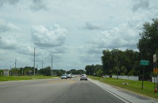 Curving northward from Geiger Road, CR 54 (Eiland Boulevard) fully enters the Zephyrhills city limits. Installation of traffic lights at Geiger Road got underway in August 2018. The signals commence operation in late November 2018.5