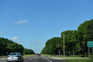 Resuming a westward heading beyond Smith Ryals Road, SR 60 advances one mile to a weigh station. The speed limit reduces from 65 to 55 m.p.h. along this stretch.