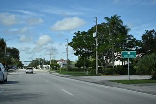 U.S. 1 follows 8th Avenue south from parallel 21st Street.