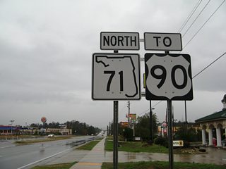 SR 71 expands to a four lane arterial through a commercialized stretch leading north from Interstate 10 to U.S. 90 southeast of Mariana.
