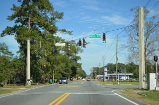 SR 71 intersects Pelt Street at a traffic light just beyond the split with U.S. 90 west.