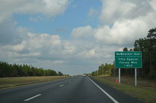 Formerly a signalized intersection, a folded diamond interchange was constructed along SR 85 at 77th Special Forces Way west and McWhorter Avenue east in 2012/13.