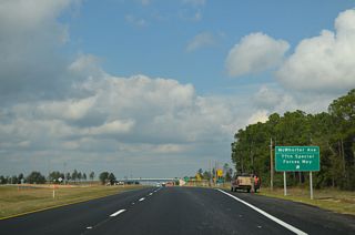 McWhorter Avenue spurs east to Duke Field within Eglin AFB. The overpass at the exchange with SR 85 is inventoried as SR 210.