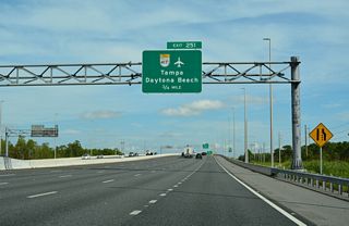 Exit 251 departs next in 0.75 miles for SR 417 (Central Florida GreeneWay) east to Orlando International Airport (MCO) and the Lake Nona area in southeast Orlando.
