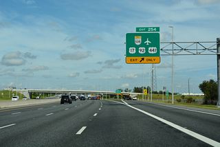 Exit 254 leaves Florida's Turnpike northbound and enters a toll plaza before partitioning into ramps for U.S. 17-92-441 (OBT) north / south and SR 528 east.