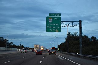 SR 408 east serves the Pine Hills and Orlo Vista communities to the east via connections with Good Homes Road or Hiawassee Road. Prior to completion of Exit 265, an interchange was planned between the Turnpike and Hiawassee Road directly.