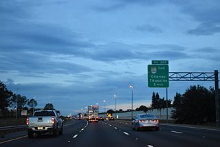 Passing north of Lake Olivia, Florida's Turnpike next meets the west end of SR 408 at Exit 265. The tolled East-West Expressway travels to Pine Hills and Downtown Orlando, providing a bypass route to SR 50 (W Colonial Drive).