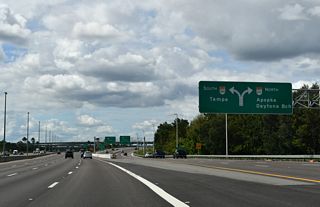 Exit 267 B separates for ramps to SR 429 north to Apopka and Sanford, and SR 429 south to Horizon West and I-4 west to Tampa.