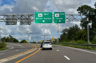 The access road at Exit 267 B ties into SR 50 (Colonial Drive) at a trumpet interchange between SR 429 (Western Beltway) and CR 439 (Maguire Road) south of Downtown Ocoee.