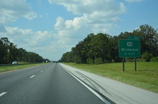 Florida's Turnpike maintains a northwesterly course between Lake Okahumpka and Hogeye Sink to a roadway separation preceding Exit 304 to U.S. 301.