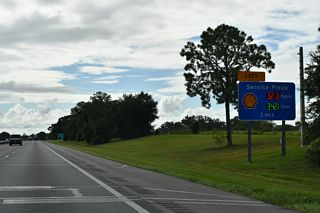 CR 468 (Warm Springs Avenue) passes over Florida's Turnpike one mile north of the Okahumpka Service Plaza in a sprawling area of the Villages community. Provisions were made during 2016-17 road work for a possible interchange with the Turnpike here.